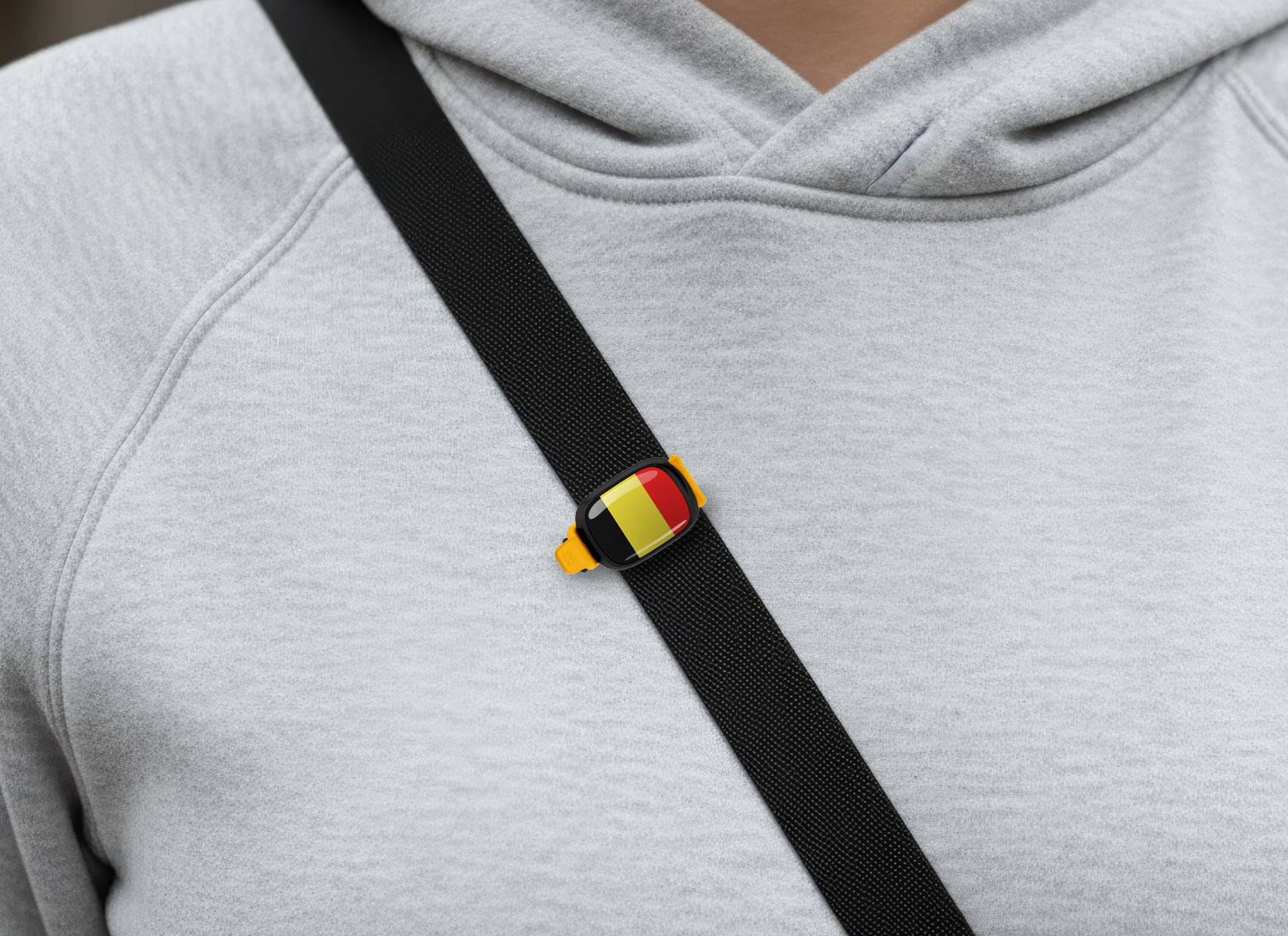 Belgium flag Stwrap bag tag shown on a bag in a lifestyle setting