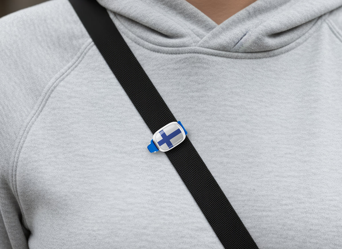 Finland flag Stwrap bag tag shown on a bag in a lifestyle setting