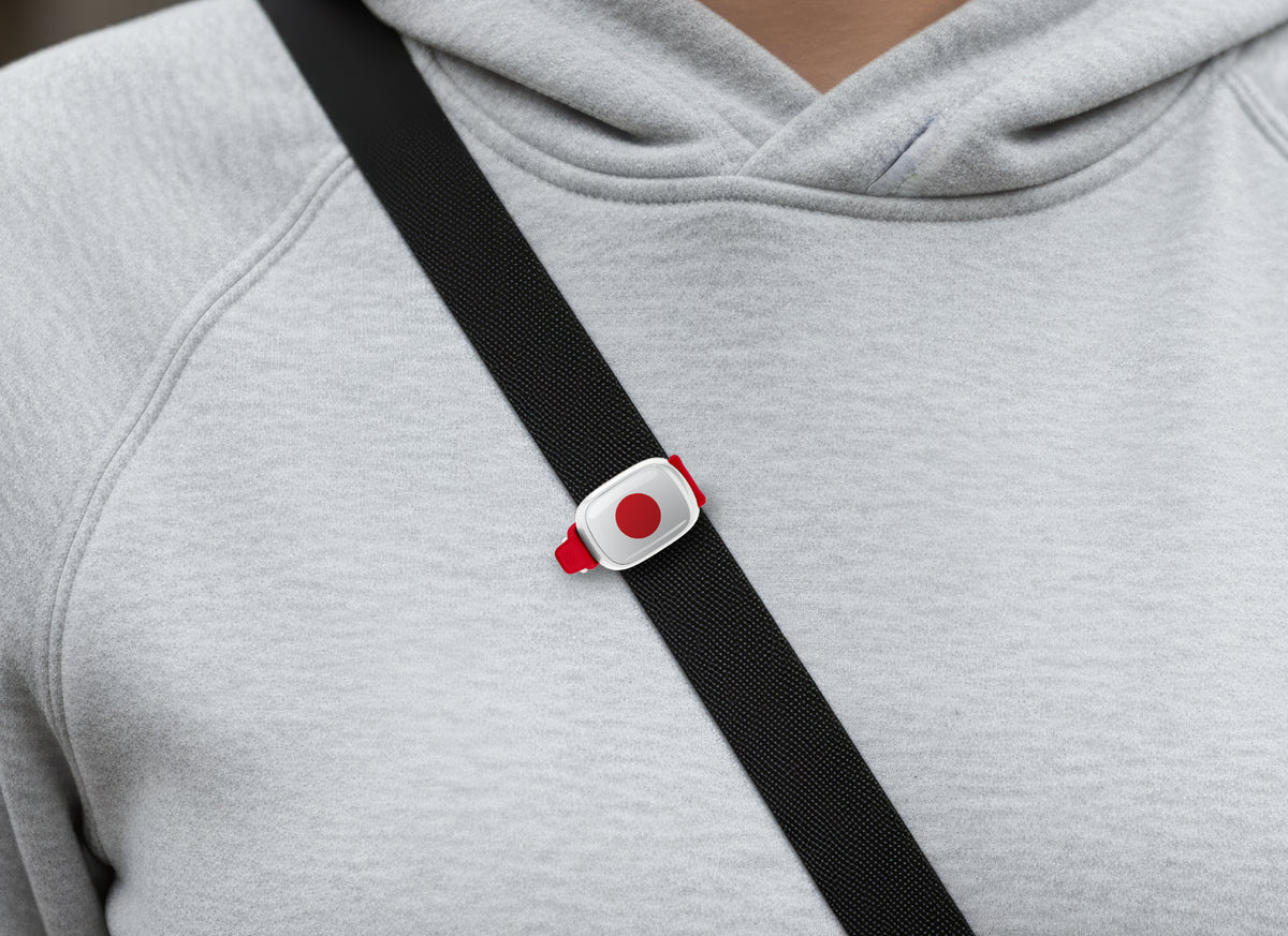 Japan flag Stwrap bag tag shown on a bag in a lifestyle setting