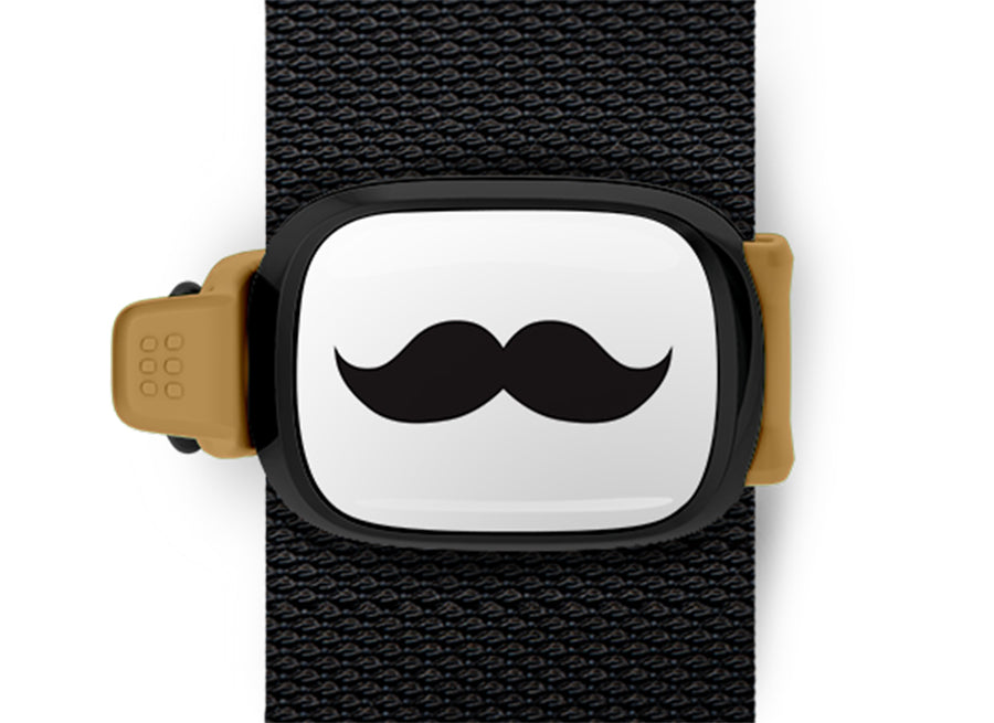 Movember Moustache Bag Tag mounted on a bag strap