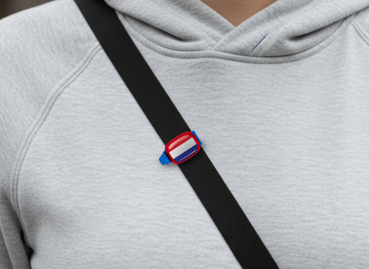 Netherlands flag Stwrap bag tag shown on a bag in a lifestyle setting