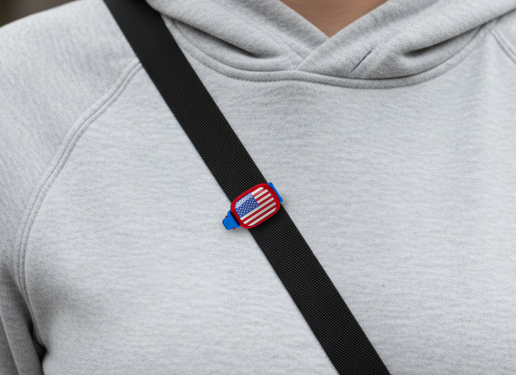USA flag Stwrap bag tag shown on a bag in a lifestyle setting