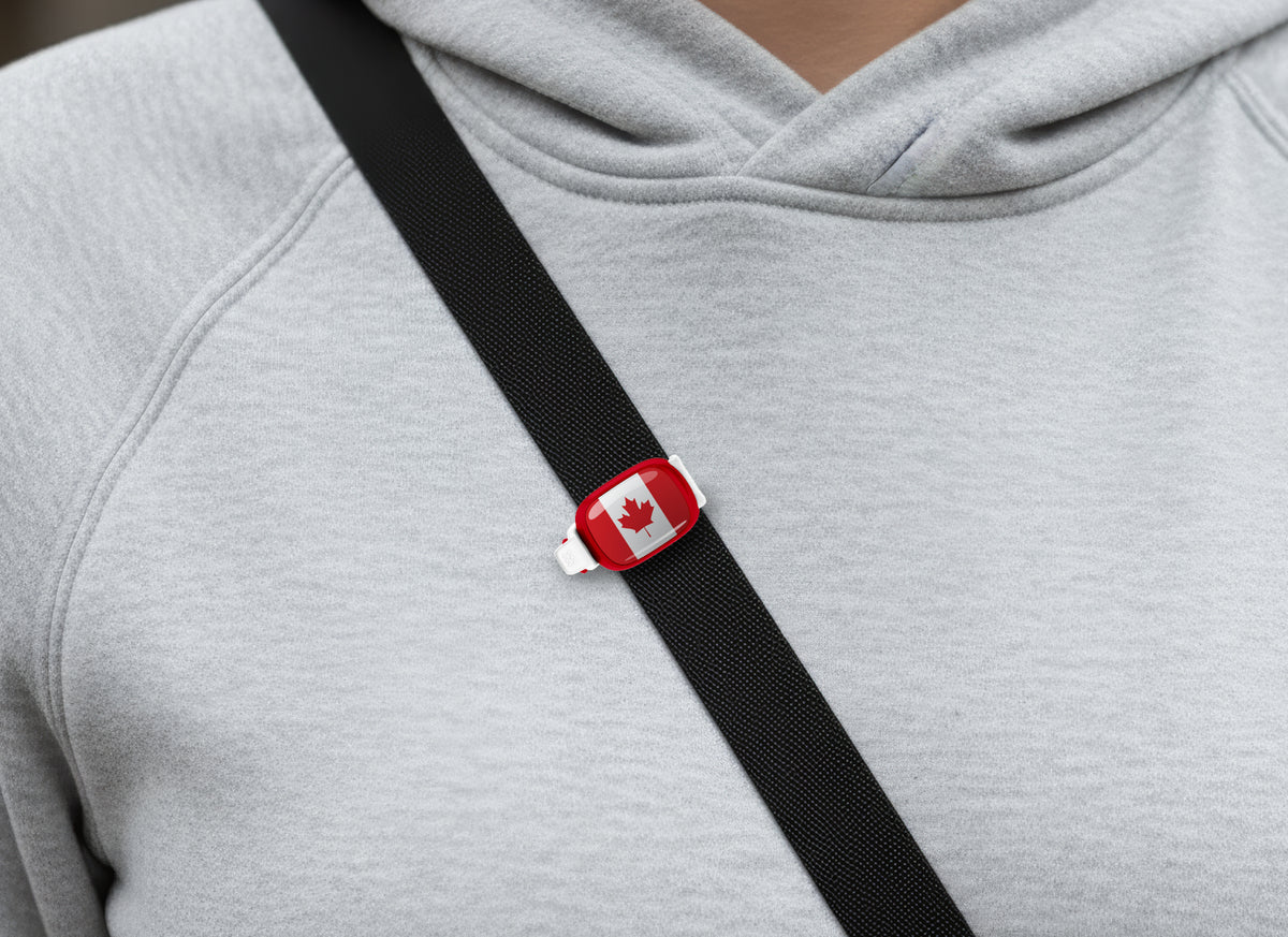 Canada flag Stwrap bag tag shown on a bag in a lifestyle setting
