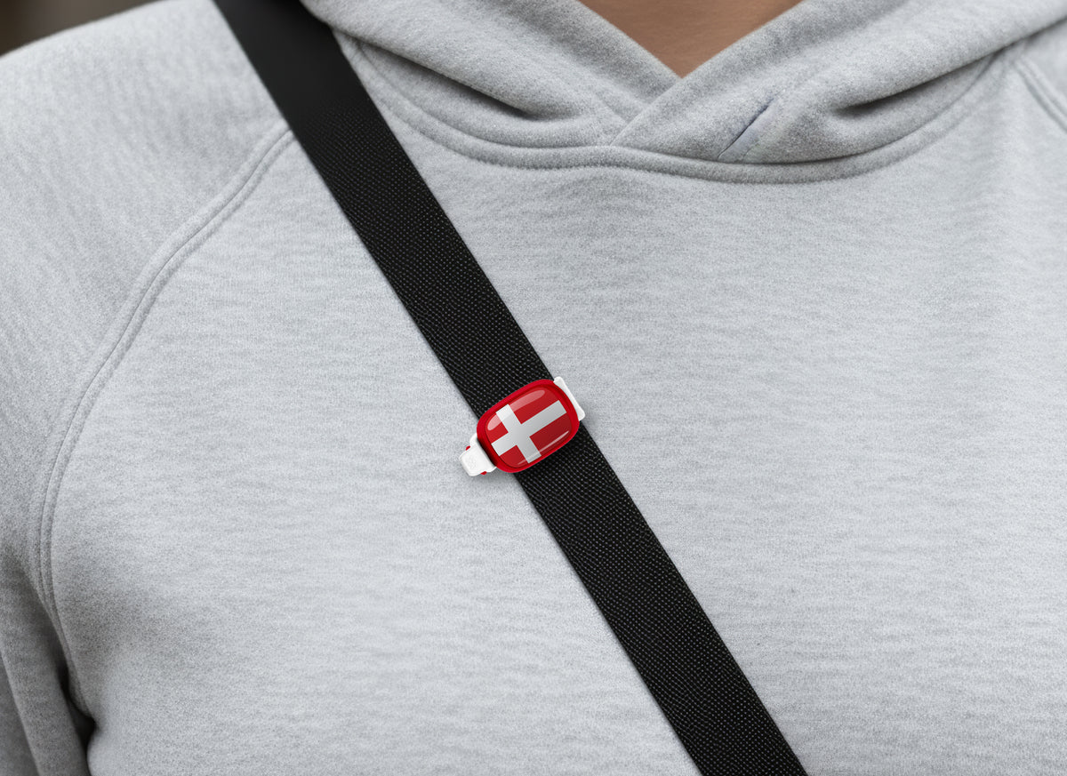 Denmark flag Stwrap bag tag shown on a bag in a lifestyle setting