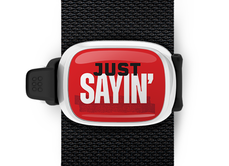 Just Sayin Bag Tag mounted on a bag strap