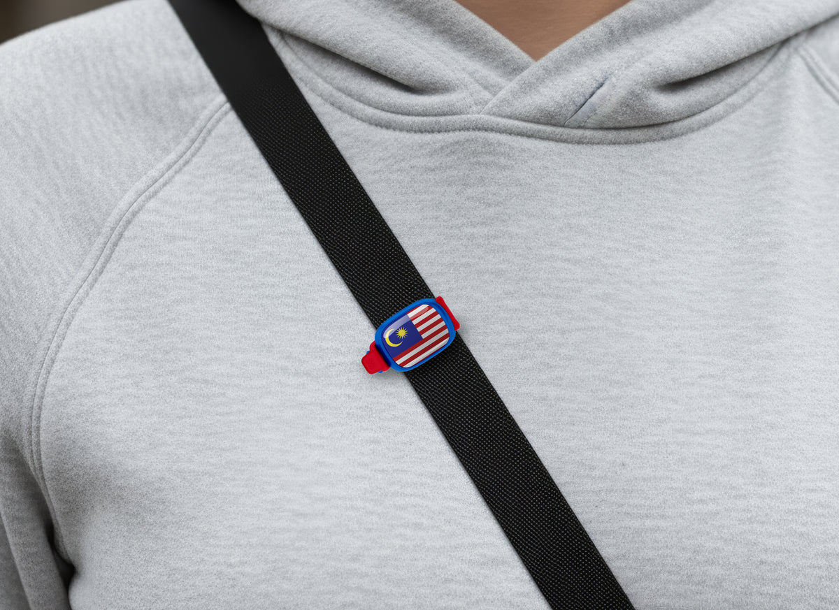 Malaysia flag Stwrap bag tag shown on a bag in a lifestyle setting