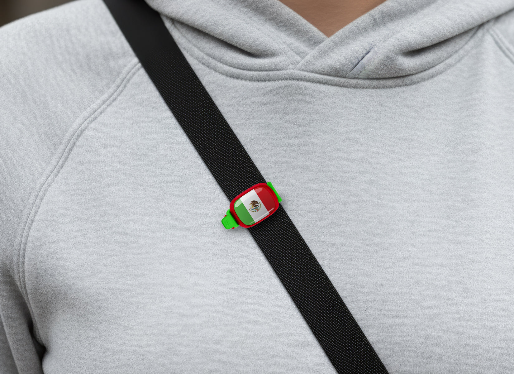 Mexico flag Stwrap bag tag shown on a bag in a lifestyle setting