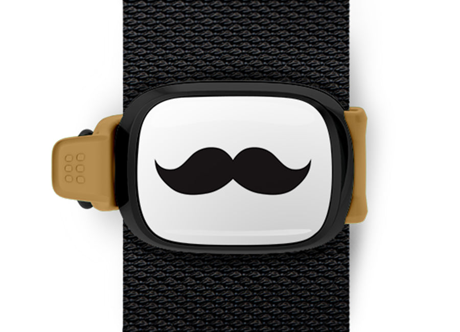 Movember Moustache Bag Tag mounted on a bag strap