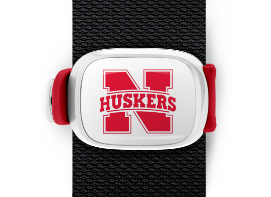 Nebraska Cornhuskers Bag Tag mounted on a bag strap