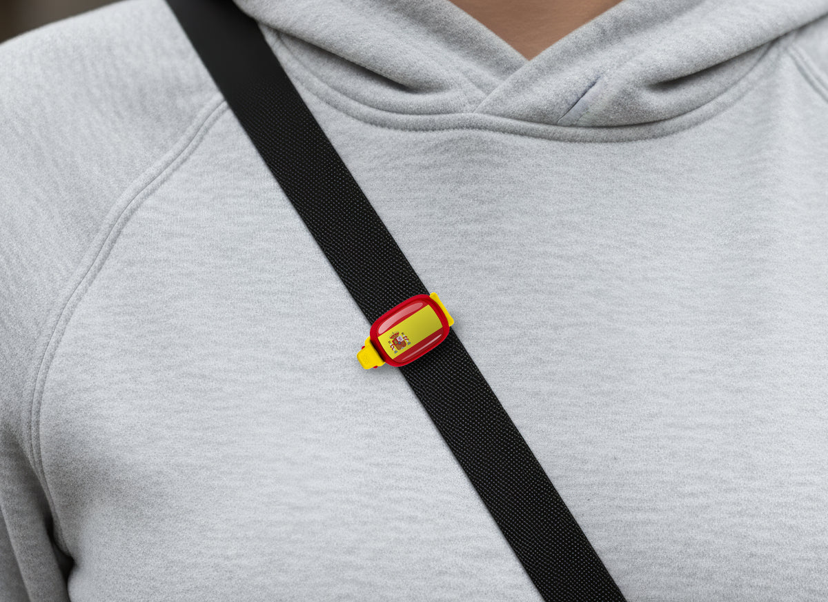 Spain flag Stwrap bag tag shown on a bag in a lifestyle setting