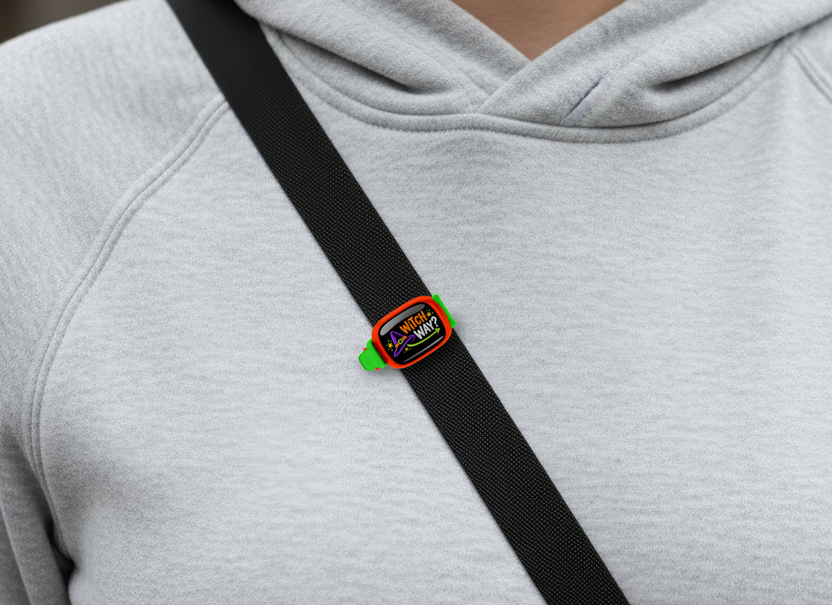 Witch Way? Stwrap bag tag on a diagonal black strap over a gray sweatshirt