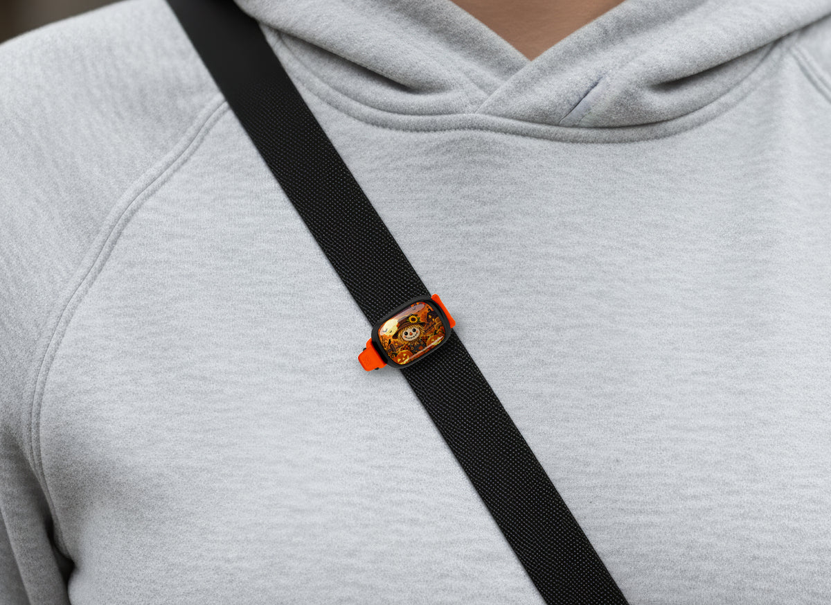 Halloween Scarecrow Stwrap bag tag on a diagonal black strap over a gray sweatshirt