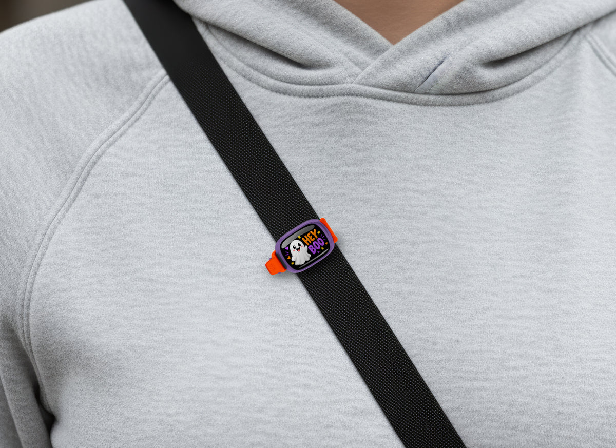 Hey Boo Stwrap bag tag on a diagonal black strap over a gray sweatshirt
