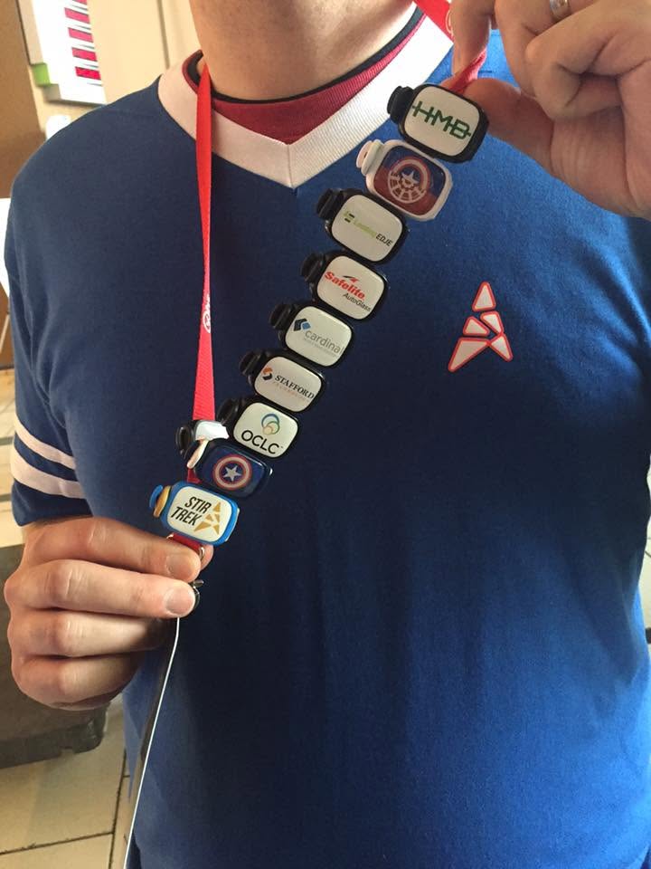 Person wearing a lanyard with multiple Stwraps collected and displayed together