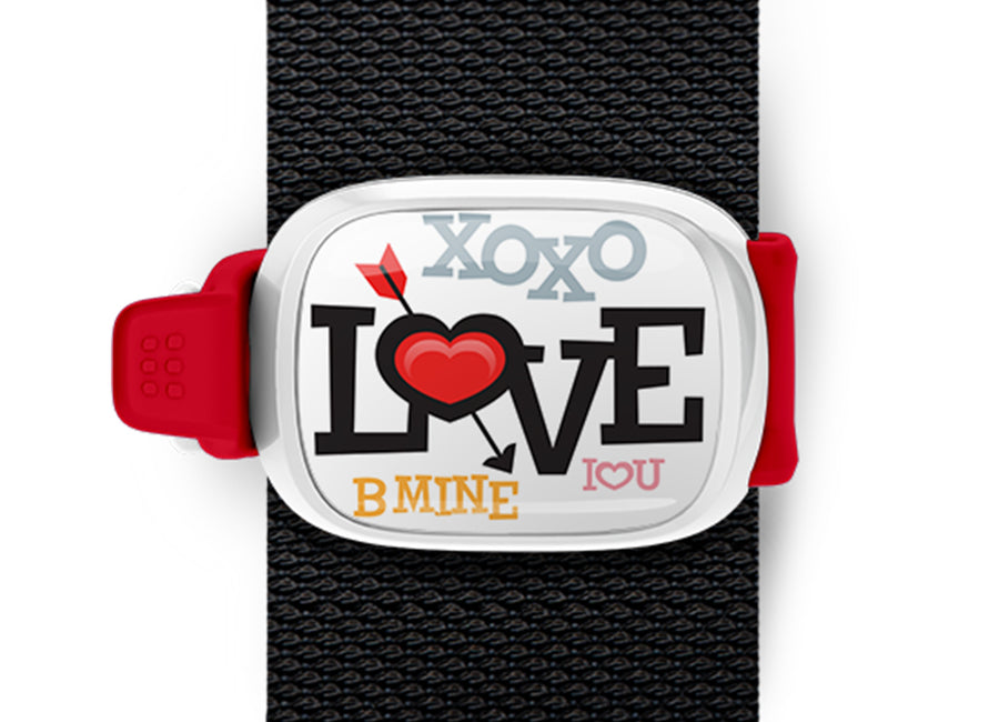 Love Bag Tag mounted on a bag strap