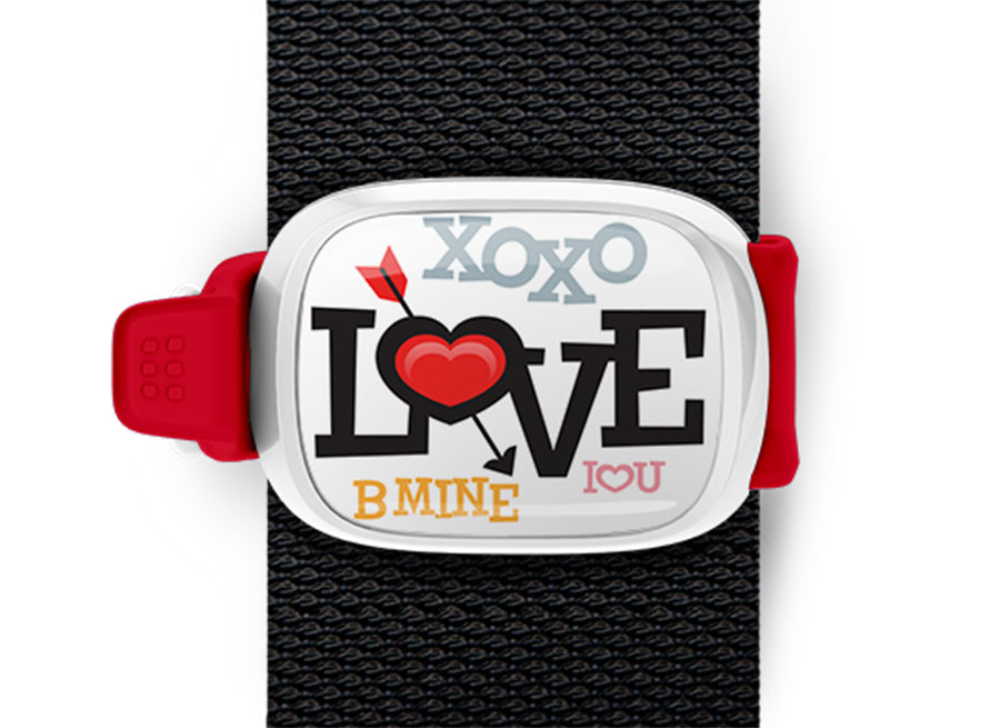 Love Bag Tag mounted on a bag strap