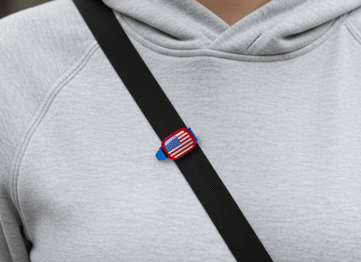 USA flag Stwrap bag tag shown on a bag in a lifestyle setting