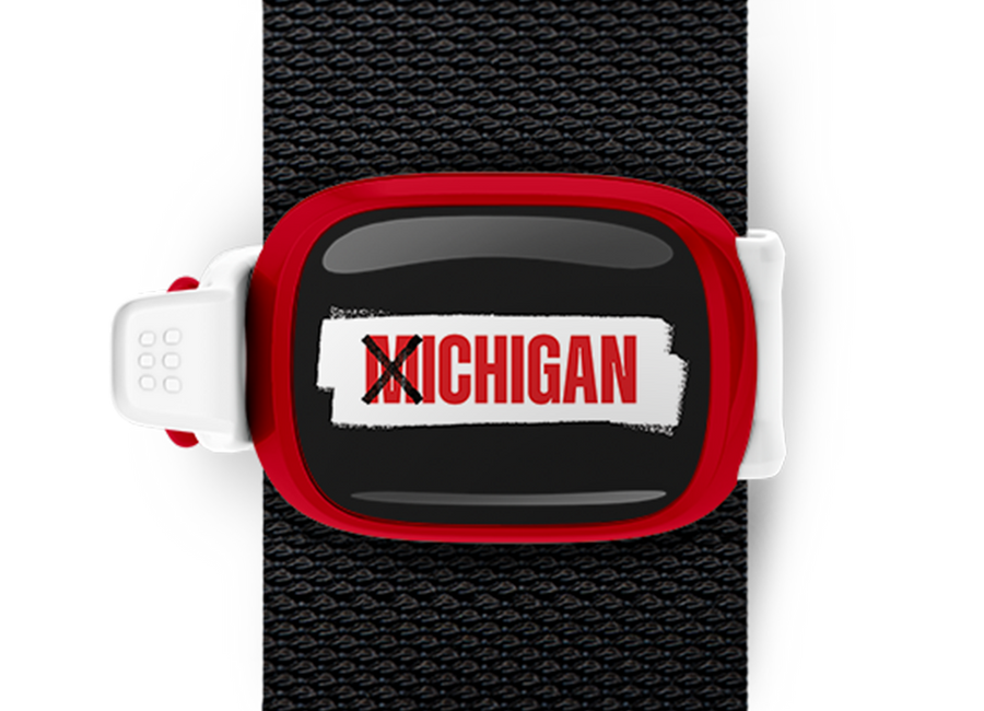 X Ichigan Bag Tag mounted on a bag strap