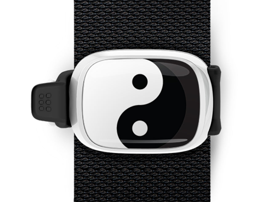 Yin Yang Bag Tag mounted on a bag strap