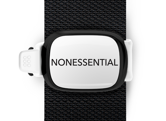 Nonessential Bag Tag mounted on a bag strap