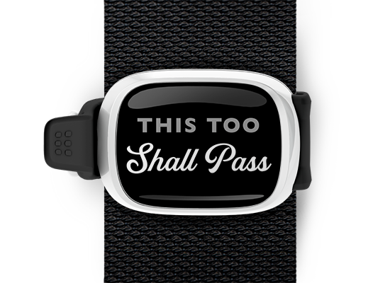 This Too Shall Pass Bag Tag mounted on a bag strap